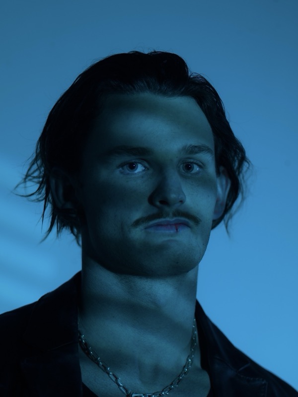 Audent front facing portrait in blue light, press photo